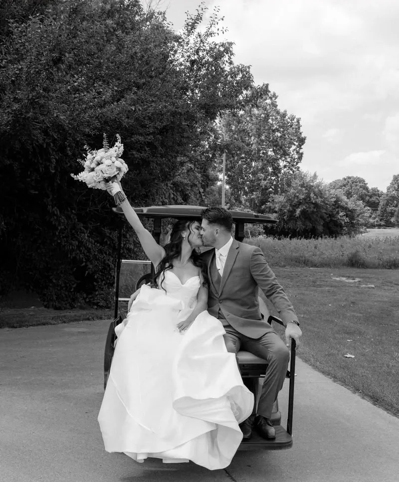 Newlyweds celebrating in a golf cart at FireRock